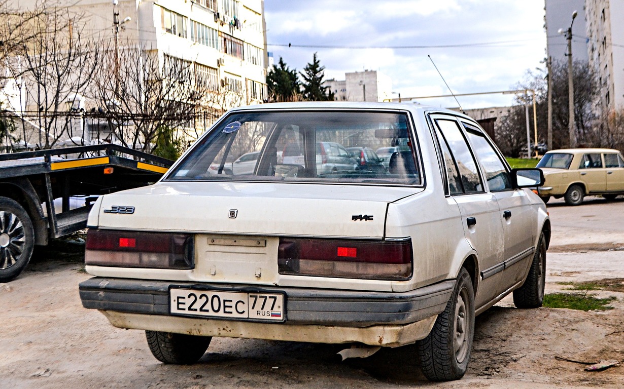 Севастополь, № Е 220 ЕС 777 — Mazda Familia (BG) '89-96