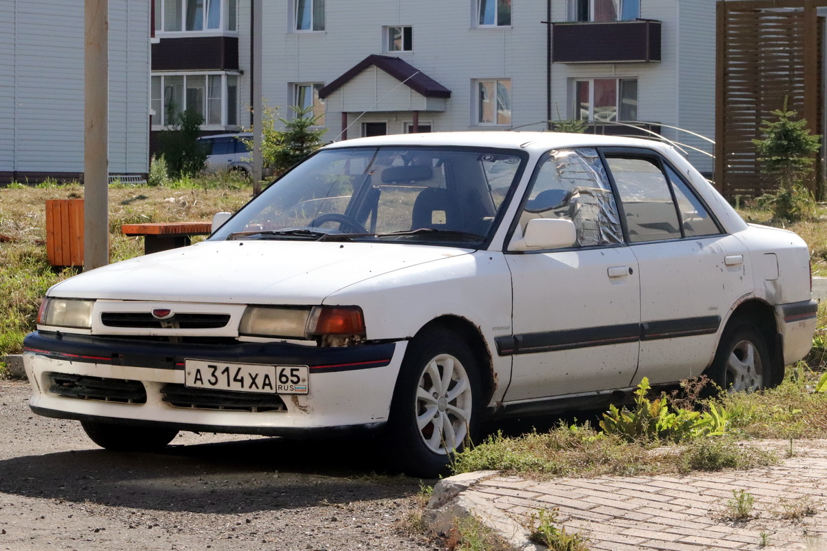 Сахалинская область, № А 314 ХА 65 — Mazda Familia (BG) '89-96