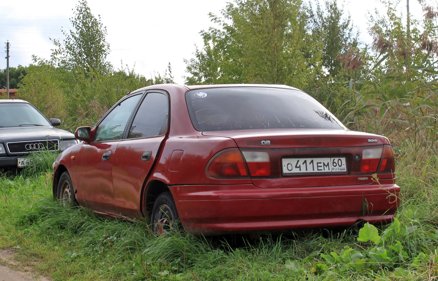 Псковская область, № О 411 ЕМ 60 — Mazda 323 (BH/BA) '94-00